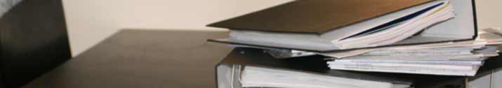 A pile of documents and reports